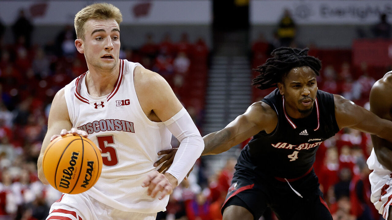 MADISON, WISCONSIN - DECEMBER 14: Tyler Wahl #5 of the Wisconsin Badgers drives to the basket past Marcellus Brigham Jr. #4 of the Jacksonville State Gamecocks in the second half of the game at Kohl Center on December 14, 2023 in Madison, Wisconsin.