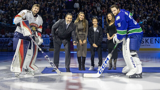 VANCOUVER, CANADA - DECEMBER 14: Forner Vancouver Canucks goaltender Roberto Luongo and his family take part in a ceremonial face-off with Thatcher Demko #35 of the Vancouver Canucks and Sergei Bobrovsky #72 of the Florida Panthers before their NHL game at Rogers Arena on December 14, 2023 in Vancouver, British Columbia, Canada.