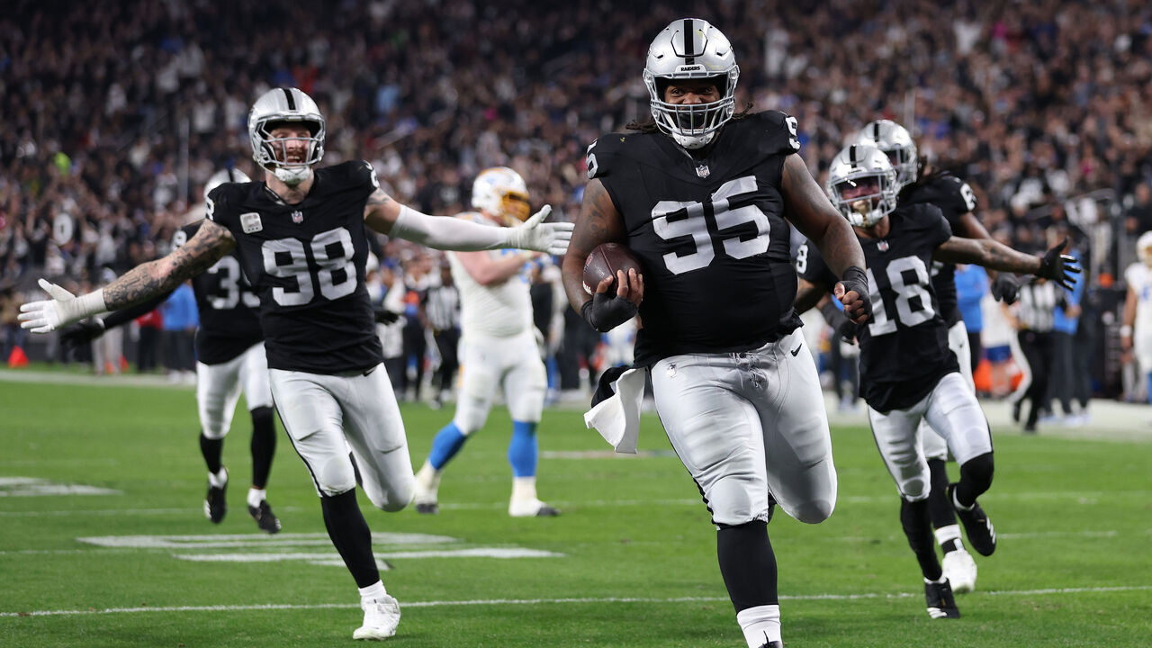 LAS VEGAS, NEVADA - DECEMBER 14: Defensive tackle John Jenkins #95 of the Las Vegas Raiders scores a touchdown against the Los Angeles Chargers during the third quarter at Allegiant Stadium on December 14, 2023 in Las Vegas, Nevada.