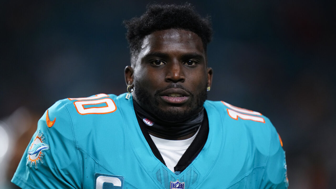 MIAMI GARDENS, FLORIDA - DECEMBER 11: Tyreek Hill #10 of the Miami Dolphins warms up prior to a game against the Tennessee Titans at Hard Rock Stadium on December 11, 2023 in Miami Gardens, Florida.