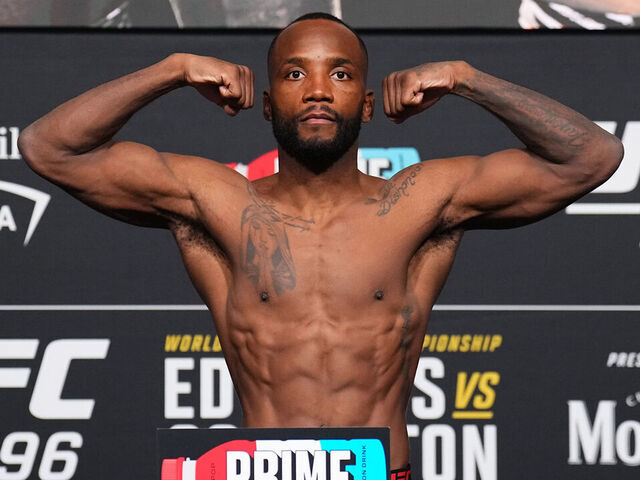 LAS VEGAS, NEVADA - DECEMBER 15: Leon Edwards of Jamaica poses on the scale during the UFC 296 official weigh-in at UFC APEX on December 15, 2023 in Las Vegas, Nevada.
