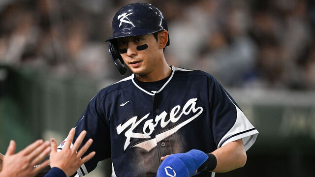 TOKYO, JAPAN - MARCH 13: Jung Hoo Lee #51 of Team Korea scores after Baekho Kang #50 of Team Korea hit a RBI single at the top of the first inning during the World Baseball Classic Pool B game between Korea and China at Tokyo Dome on March 13, 2023 in Tokyo, Japan.