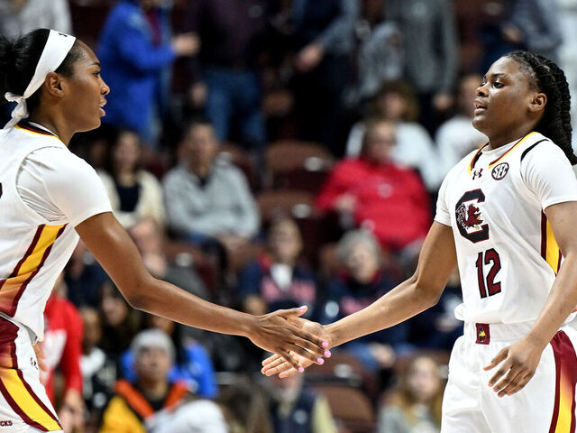 UNCASVILLE, CONNECTICUT - DECEMBER 10: MiLaysia Fulwiley #12 of the South Carolina Gamecocks celebrates with Bree Hall #23 during the game against the Utah Utes at Mohegan Sun Arena on December 10, 2023 in Uncasville, Connecticut.