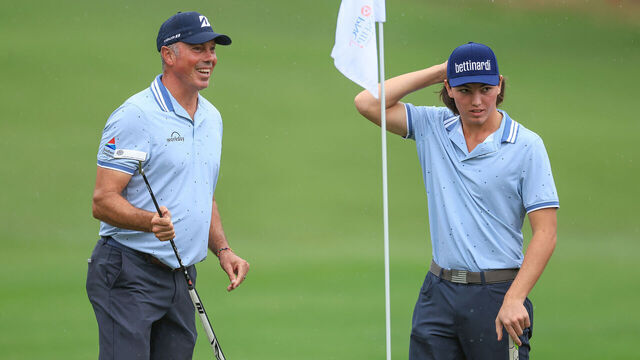 ORLANDO, FLORIDA - DECEMBER 16: Matt Kuchar of The United States and his son Cameron Kuchar on the ninth green (their final hole) after they had posted a round of 57, 15 under par total during the first round of the PNC Championship at The Ritz-Carlton Golf Club on December 16, 2023 in Orlando, Florida.