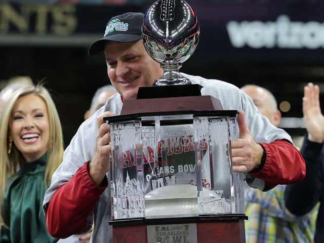 NEW ORLEANS, LOUISIANA - DECEMBER 16: Head coach Rich Rodriguez of the Jacksonville State Gamecocks holds the trophy after a win over the Louisiana-Lafayette Ragin Cajuns in the R+L Carriers New Orleans Bowl at Caesars Superdome on December 16, 2023 in New Orleans, Louisiana.