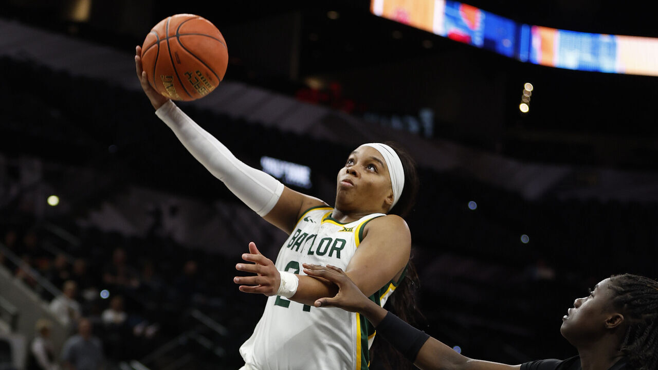 SAN ANTONIO, TX - DECEMBER 16: Sarah Andrews #24 of the Baylor Bears scores over the Miami Hurricanes in the second half of the 2023 Hall of Fame Series San Antonio at Frost Bank Center on December 16, 2023 in San Antonio, Texas.