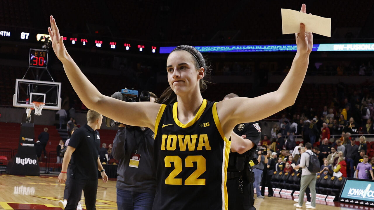 AMES, IA - DECEMBER 6: Caitlin Clark #22 of the Iowa Hawkeyes reacts after the Iowa Hawkeyes won 67-58 over the Iowa State Cyclones. Clark became the 15th player in Division I women's basketball history to reach 3,000 points for her career when she broke 3,000 points with a three point basket in the game at Hilton Coliseum on December 6, 2023 in Ames, Iowa. They Iowa Hawkeyes won 67-58 over the Iowa State Cyclones.
