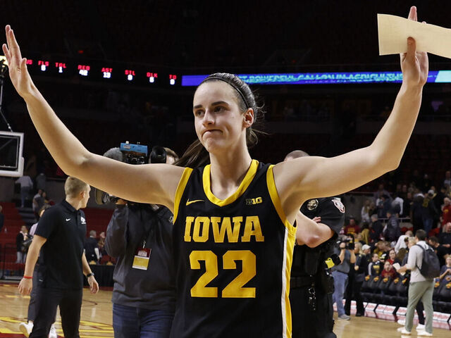 AMES, IA - DECEMBER 6: Caitlin Clark #22 of the Iowa Hawkeyes reacts after the Iowa Hawkeyes won 67-58 over the Iowa State Cyclones. Clark became the 15th player in Division I women's basketball history to reach 3,000 points for her career when she broke 3,000 points with a three point basket in the game at Hilton Coliseum on December 6, 2023 in Ames, Iowa. They Iowa Hawkeyes won 67-58 over the Iowa State Cyclones.