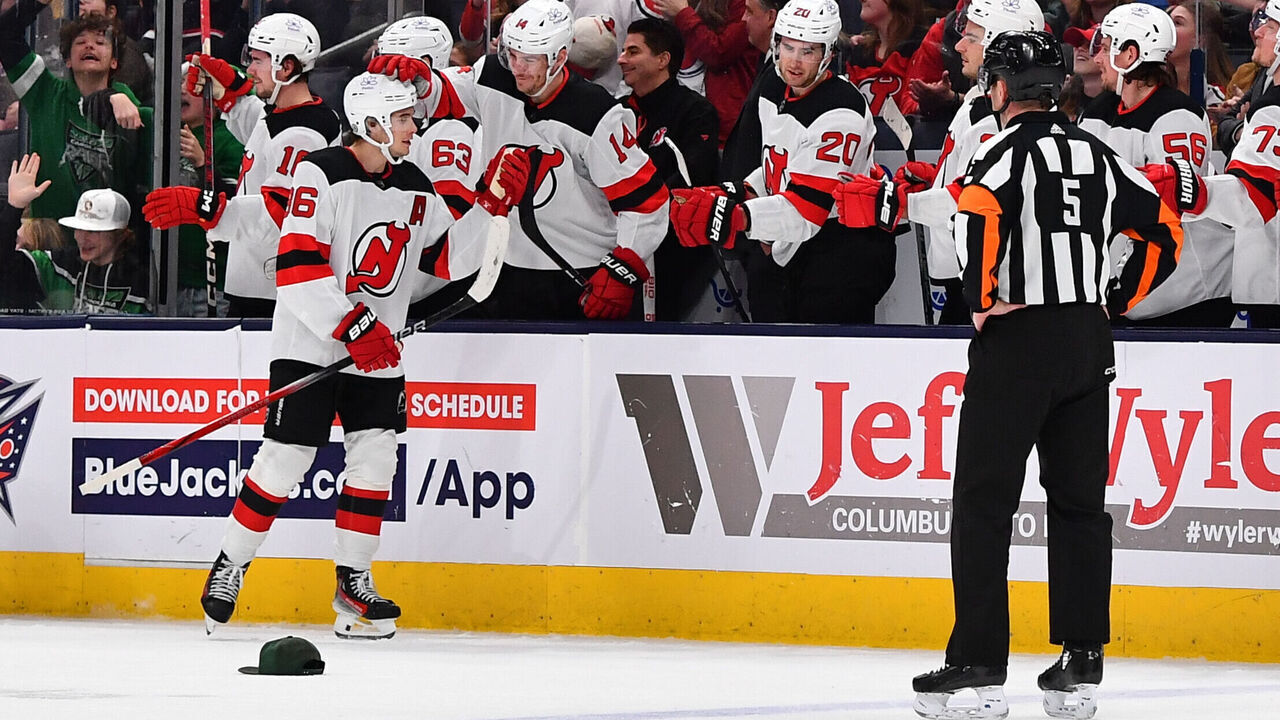 COLUMBUS, OHIO - DECEMBER 16: Jack Hughes #86 of the New Jersey Devils celebrates with his teammates after scoring a hat-trick in the third period of a game against the Columbus Blue Jackets at Nationwide Arena on December 16, 2023 in Columbus, Ohio.