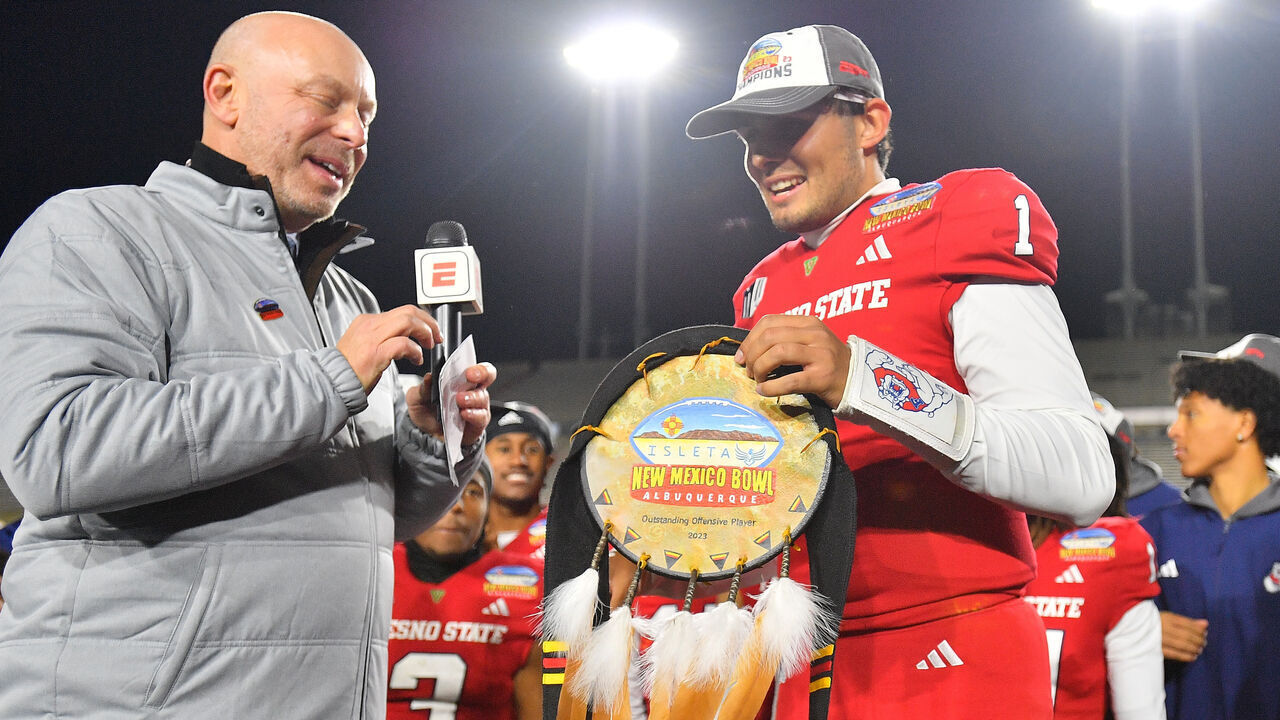 ALBUQUERQUE, NEW MEXICO - DECEMBER 16: Quarterback Mikey Keene #1 of the Fresno State Bulldogs holds the Outstanding Offensive Player award after the Bulldogs defeated the New Mexico State Aggies 37-10 in the Isleta New Mexico Bowl at University Stadium on December 16, 2023 in Albuquerque, New Mexico.