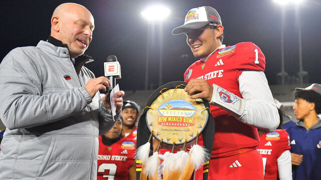 ALBUQUERQUE, NEW MEXICO - DECEMBER 16: Quarterback Mikey Keene #1 of the Fresno State Bulldogs holds the Outstanding Offensive Player award after the Bulldogs defeated the New Mexico State Aggies 37-10 in the Isleta New Mexico Bowl at University Stadium on December 16, 2023 in Albuquerque, New Mexico.