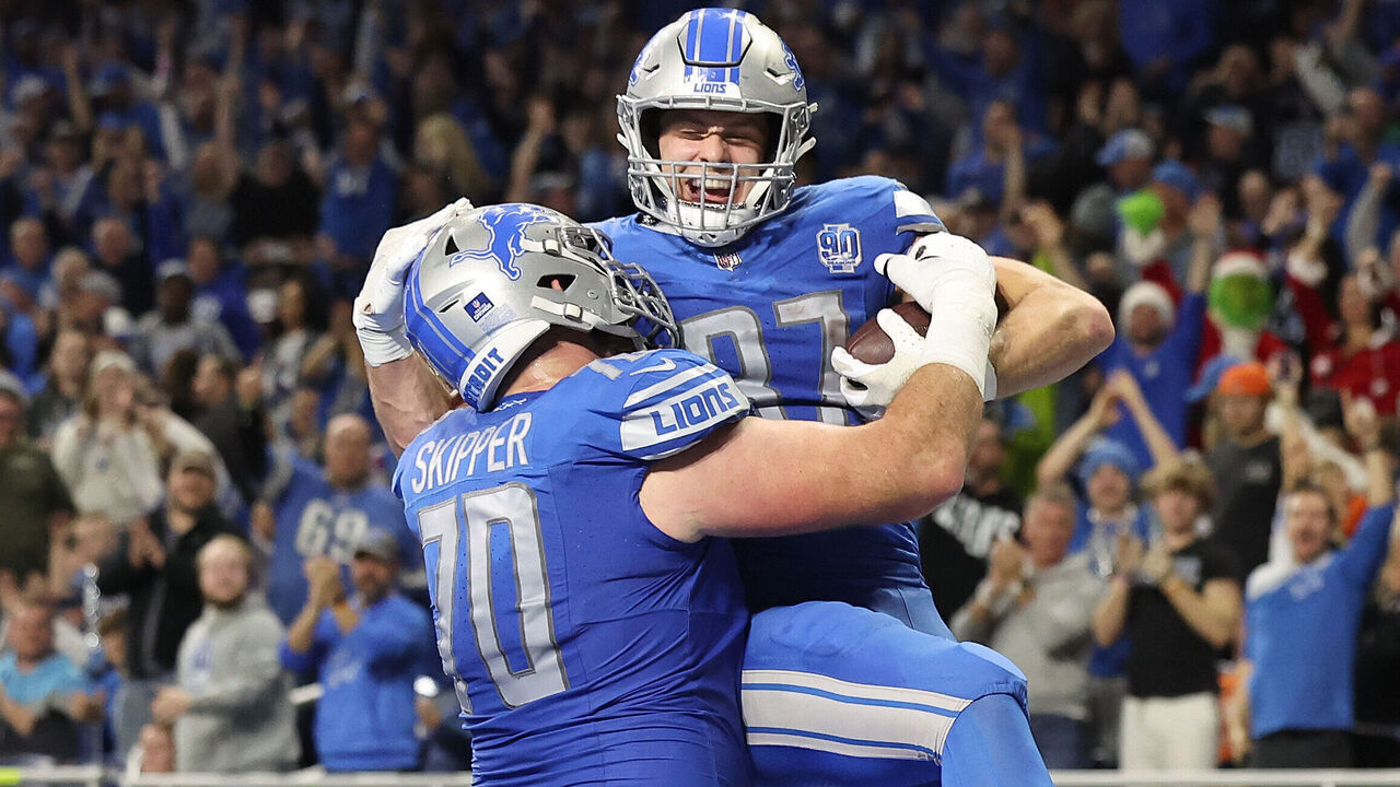 DETROIT, MICHIGAN - DECEMBER 16: Sam LaPorta #87 of the Detroit Lions celebrates his touchdown catch with Dan Skipper #70 during the fourth quarter against the Denver Broncos at Ford Field on December 16, 2023 in Detroit, Michigan.