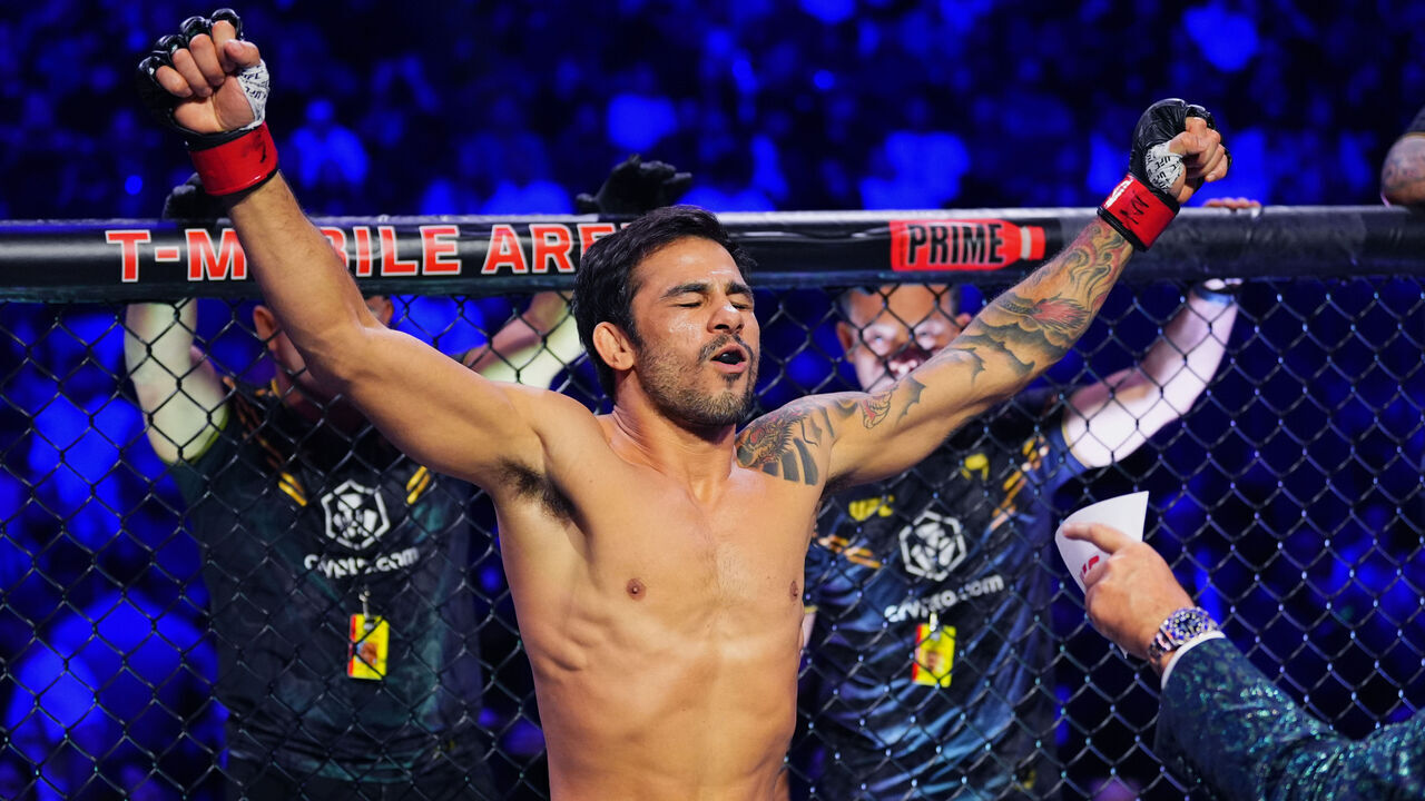 LAS VEGAS, NEVADA - DECEMBER 16: Alexandre Pantoja of Brazil enters the Octagon in the UFC flyweight championship fight during the UFC 296 event at T-Mobile Arena on December 16, 2023 in Las Vegas, Nevada.