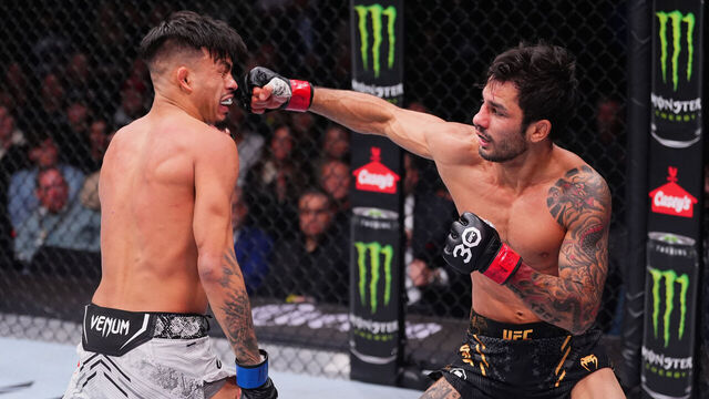 LAS VEGAS, NEVADA - DECEMBER 16: (R-L) Alexandre Pantoja of Brazil punches Brandon Royval in the UFC flyweight championship fight during the UFC 296 event at T-Mobile Arena on December 16, 2023 in Las Vegas, Nevada.