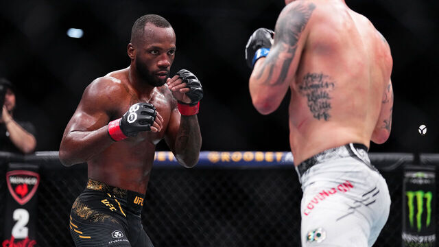 LAS VEGAS, NEVADA - DECEMBER 16: (L-R) Leon Edwards of Jamaica faces Colby Covington in the UFC welterweight championship fight during the UFC 296 event at T-Mobile Arena on December 16, 2023 in Las Vegas, Nevada.