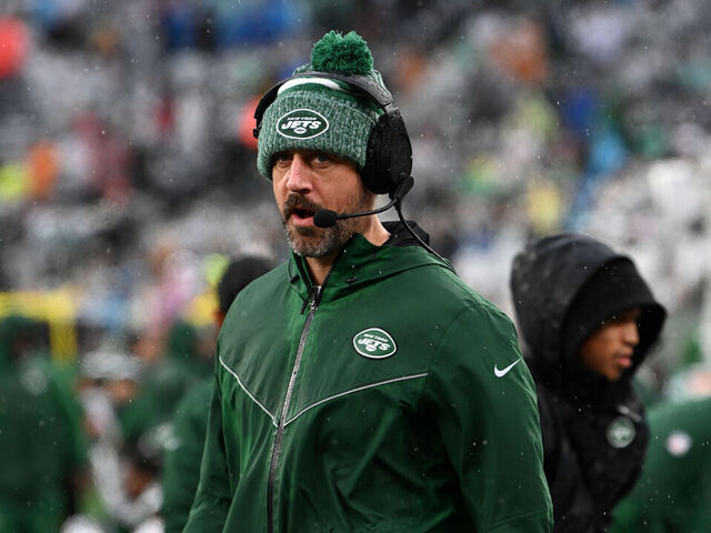 EAST RUTHERFORD, NJ - DECEMBER 10: New York Jets QB Aaron Rodgers watches action during game featuring the Houston Texans and the New York Jets on December 10, 2023 at MetLife Stadium in East Rutherford, NJ.