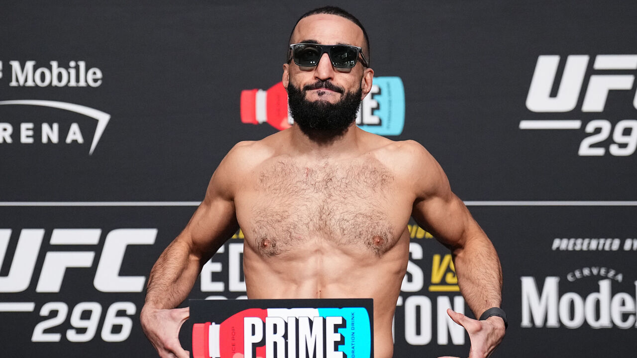 LAS VEGAS, NEVADA - DECEMBER 15: Belal Muhammad poses on the scale during the UFC 296 official weigh-in at UFC APEX on December 15, 2023 in Las Vegas, Nevada.