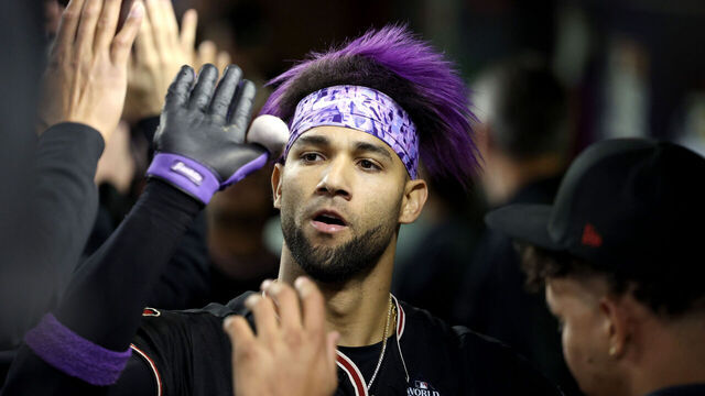 PHOENIX, ARIZONA - OCTOBER 31: Lourdes Gurriel Jr. #12 of the Arizona Diamondbacks celebrates with teammates after hitting a home run in the eighth inning against the Texas Rangers during Game Four of the World Series at Chase Field on October 31, 2023 in Phoenix, Arizona.