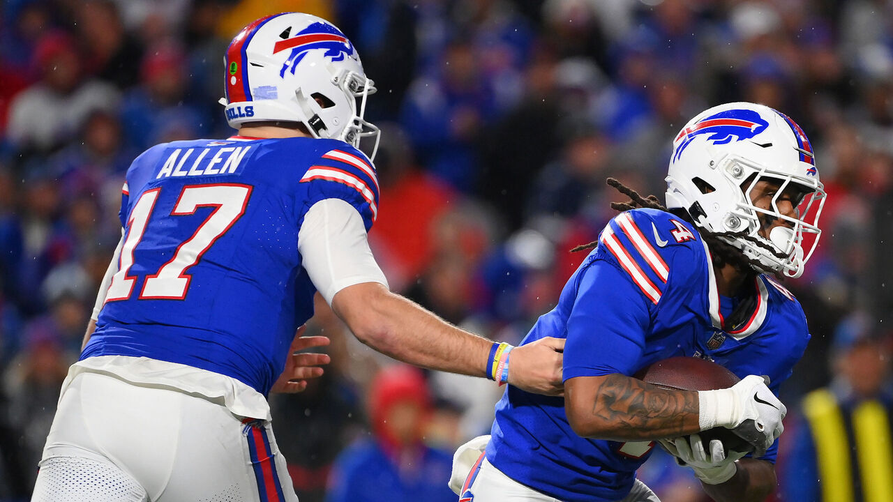 ORCHARD PARK, NEW YORK - DECEMBER 17: Josh Allen #17 hands the ball off to James Cook #4 both of the Buffalo Bills during the second quarter against the Dallas Cowboys at Highmark Stadium on December 17, 2023 in Orchard Park, New York.