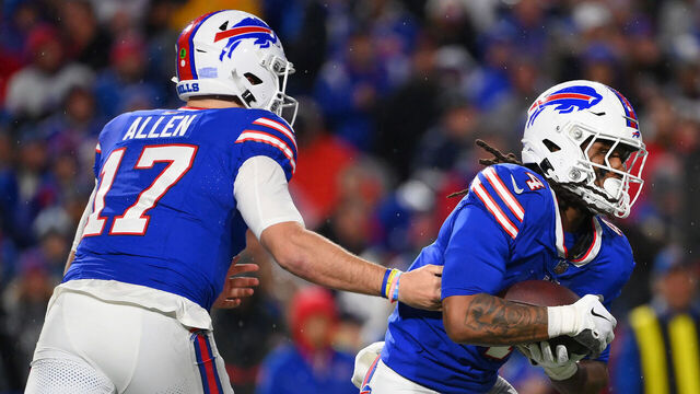 ORCHARD PARK, NEW YORK - DECEMBER 17: Josh Allen #17 hands the ball off to James Cook #4 both of the Buffalo Bills during the second quarter against the Dallas Cowboys at Highmark Stadium on December 17, 2023 in Orchard Park, New York.