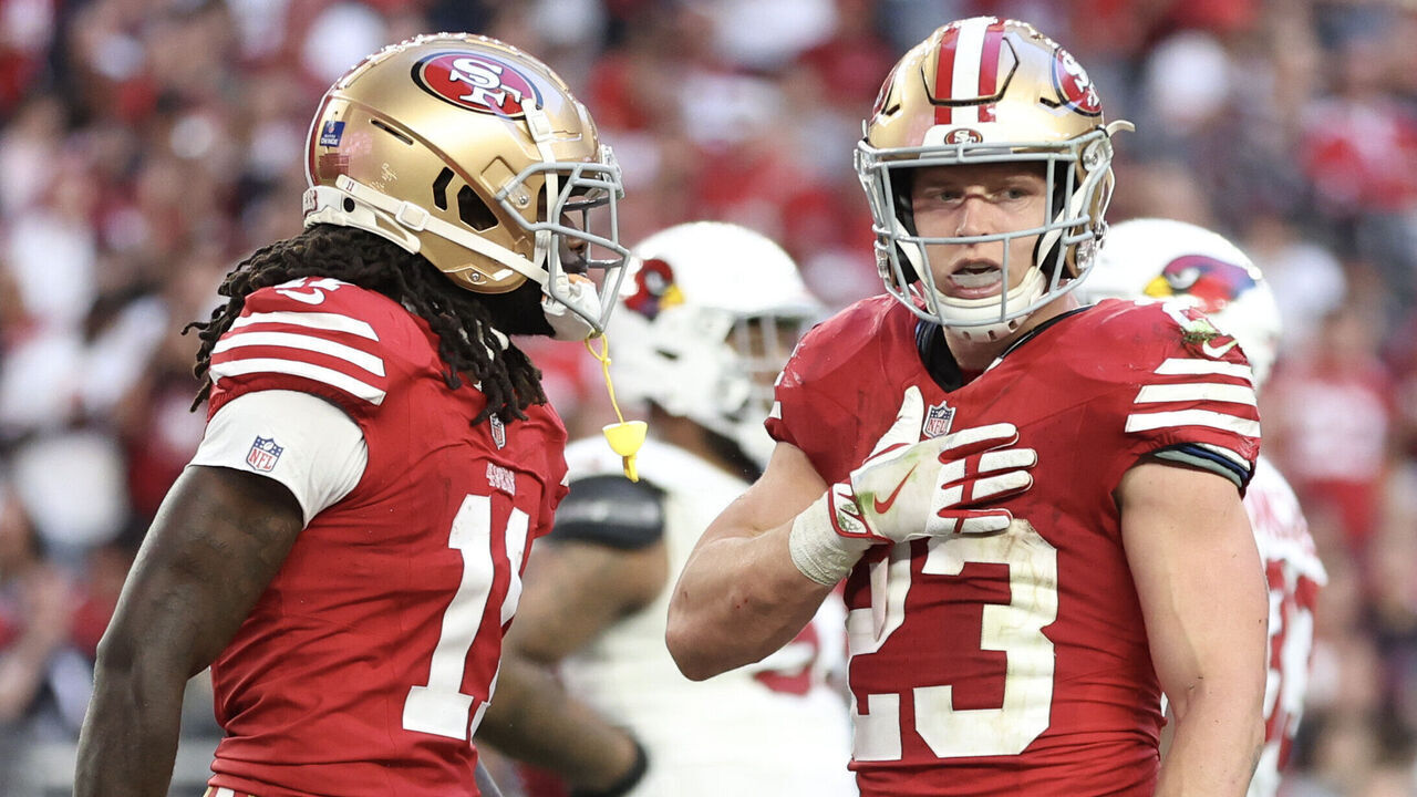 GLENDALE, ARIZONA - DECEMBER 17: Christian McCaffrey #23 of the San Francisco 49ers reacts after scoring a touchdown during the third quarter of a game against the Arizona Cardinals at State Farm Stadium on December 17, 2023 in Glendale, Arizona.