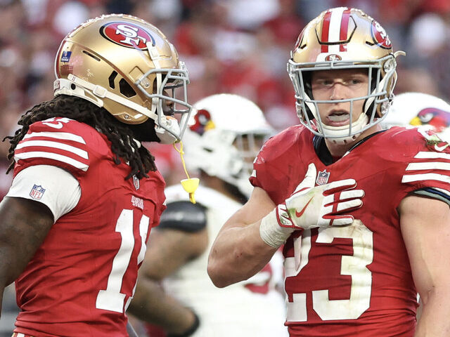 GLENDALE, ARIZONA - DECEMBER 17: Christian McCaffrey #23 of the San Francisco 49ers reacts after scoring a touchdown during the third quarter of a game against the Arizona Cardinals at State Farm Stadium on December 17, 2023 in Glendale, Arizona.