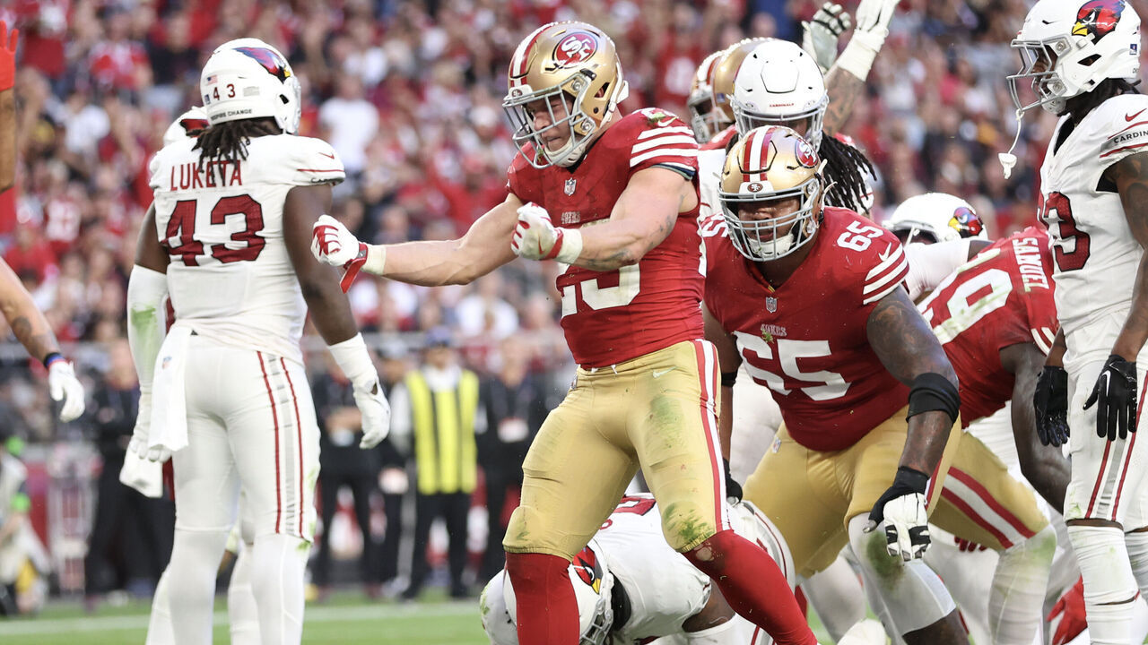 GLENDALE, ARIZONA - DECEMBER 17: Christian McCaffrey #23 of the San Francisco 49ers reacts after scoring a touchdown during the third quarter of a game against the Arizona Cardinals at State Farm Stadium on December 17, 2023 in Glendale, Arizona.