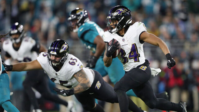 JACKSONVILLE, FLORIDA - DECEMBER 17: Keaton Mitchell #34 of the Baltimore Ravens runs with the ball against the Jacksonville Jaguars during the third quarter at EverBank Stadium on December 17, 2023 in Jacksonville, Florida.