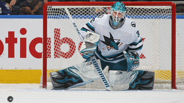 TORONTO, CANADA - NOVEMBER 30: Aaron Dell #30 of the San Jose Sharks watches a puck against the Toronto Maple Leafs during an NHL game at Scotiabank Arena on November 30, 2022 in Toronto, Ontario, Canada. The Maple Leafs defeated the Sharks 3-1.