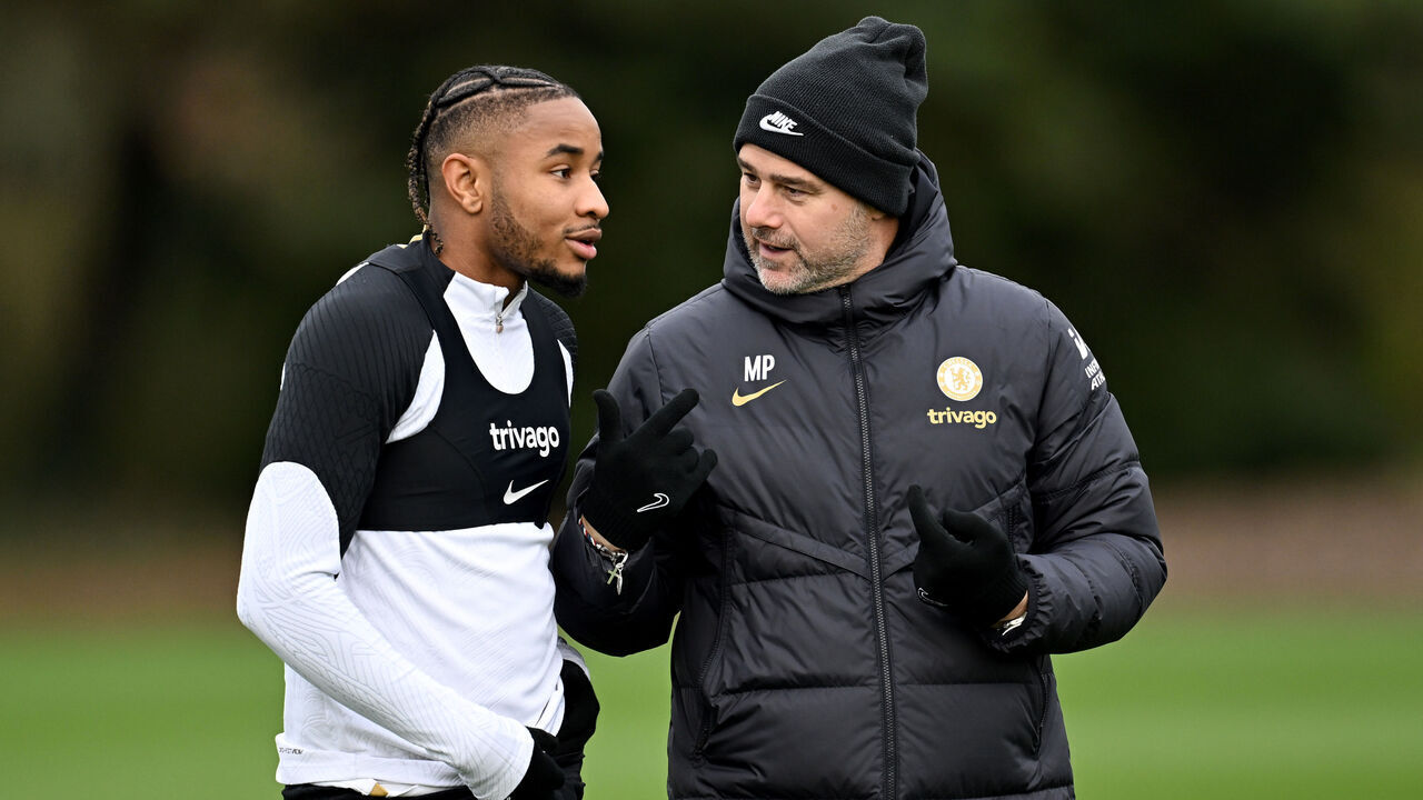COBHAM, ENGLAND - DECEMBER 18: Christopher Nkunku and Head Coach Mauricio Pochettino of Chelsea during a training session at Chelsea Training Ground on December 18, 2023 in Cobham, England.