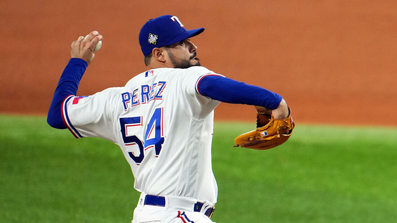 ARLINGTON, TX - OCTOBER 28: Martin Perez #54 of the Texas Rangers pitches in the eighth inning during Game 2 of the 2023 World Series between the Arizona Diamondbacks and the Texas Rangers at Globe Life Field on Saturday, October 28, 2023 in Arlington, Texas.