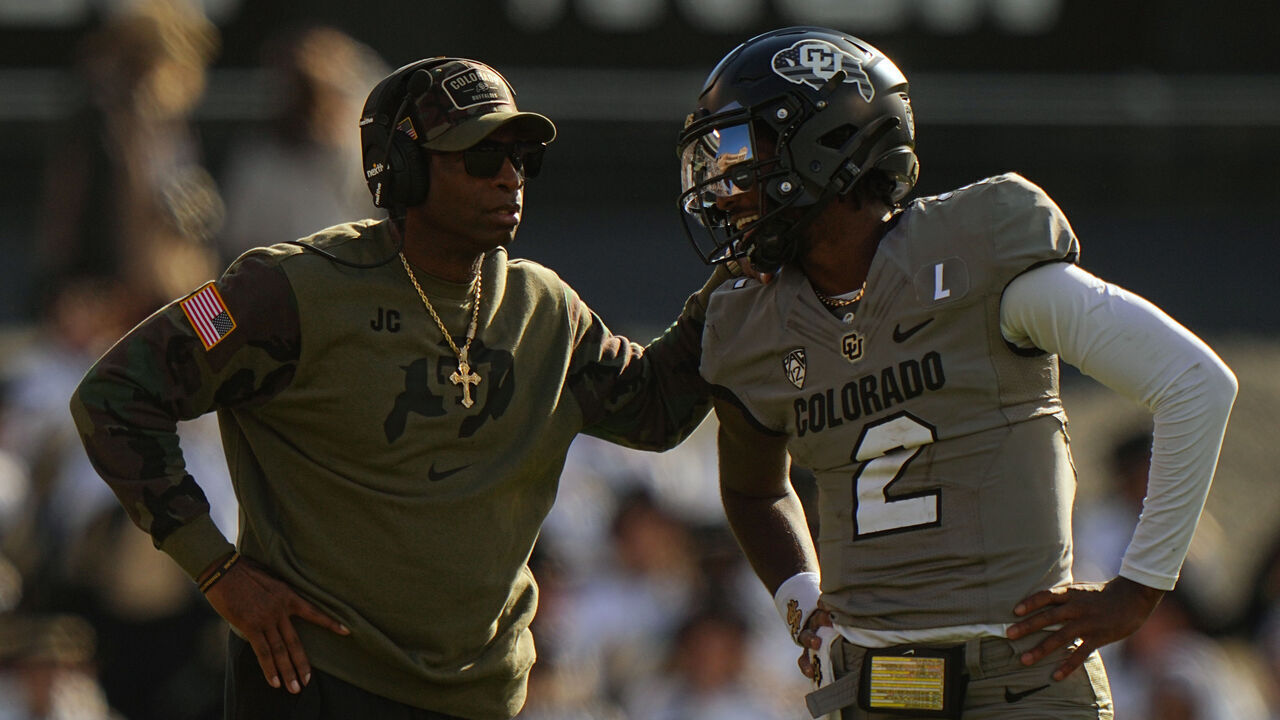 College Football: Colorado head coach Deion Sanders talks with quarterback Shedeur Sanders (2) vs Arizona at Folsom Field. Boulder, CO 11/11/2023 CREDIT: Erick W. Rasco (Set Number: X164462)