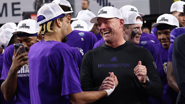 LAS VEGAS, NV - DECEMBER 01: Washington Huskies head coach Kalen DeBoer celebrates alongside his players after defeating the Oregon Ducks 34-31 in a PAC-12 Championship Game Friday, Dec. 1, 2023, at Allegiant Stadium in Las Vegas, Nevada.