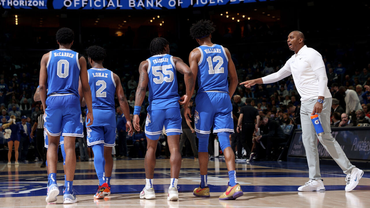 MEMPHIS, TN - FEBRUARY 26: Penny Hardaway, head coach of the Memphis Tigers talks to Elijah McCadden #0, Alex Lomax #2, Damaria Franklin #55 and DeAndre Williams #12 of the Memphis Tigers during the 2nd half against the Cincinnati Bearcats on February 26, 2023 at FedExForum in Memphis, Tennessee. Memphis defeated Cincinnati 76-73.
