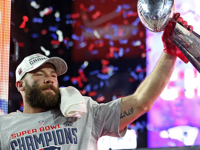 (020115 Glendale, AZ) New England Patriots wide receiver Julian Edelman celebrates with the trophy. The New England Patriots take on the Seattle Seahawks in Super Bowl XLIX in Glendale, AZ. (Sunday,February 1, 2015). Staff Photo by Nancy Lane