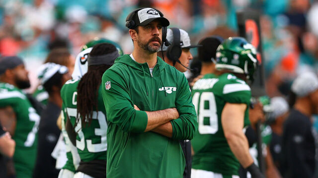 MIAMI GARDENS, FLORIDA - DECEMBER 17: Aaron Rodgers #8 of the New York Jets looks on during the fourth quarter of the game against the Miami Dolphins at Hard Rock Stadium on December 17, 2023 in Miami Gardens, Florida.