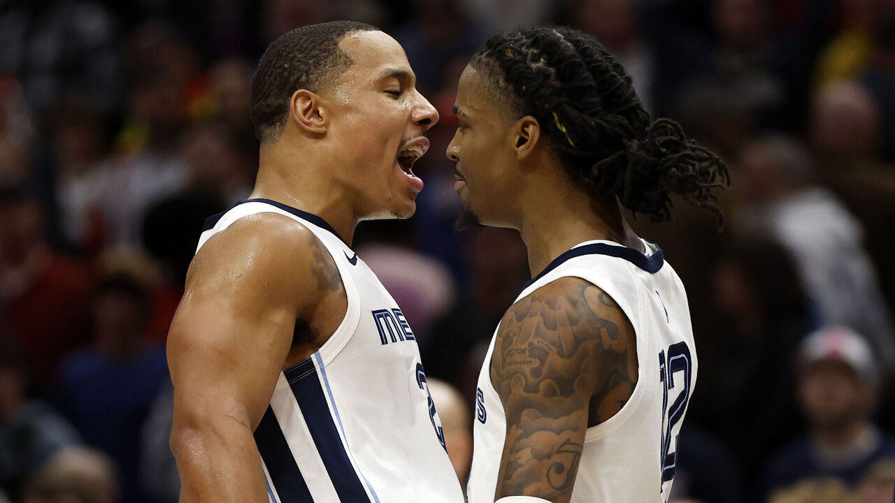 NEW ORLEANS, LOUISIANA - DECEMBER 19: Ja Morant #12 of the Memphis Grizzlies reacts with his team after defeating the New Orleans Pelicans at Smoothie King Center on December 19, 2023 in New Orleans, Louisiana.