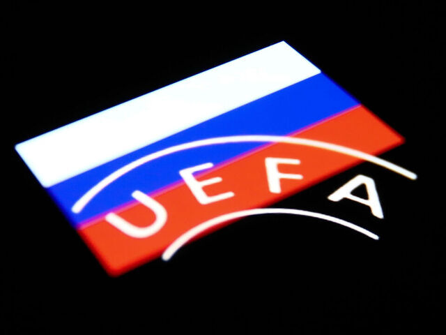 UEFA logo displayed on a phone screen and Russian flag displayed on a phone screen are seen in this multiple exposure illustration photo taken in Krakow, Poland on February 28, 2022. (Photo illustration by Jakub Porzycki/NurPhoto via Getty Images)