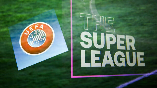 UEFA logo displayed on a phone screen and The Super League logo displayed on a screen are seen in this multiple exposure illustration photo taken in Krakow, Poland on April 20, 2021. (Photo Illustration by Jakub Porzycki/NurPhoto via Getty Images)