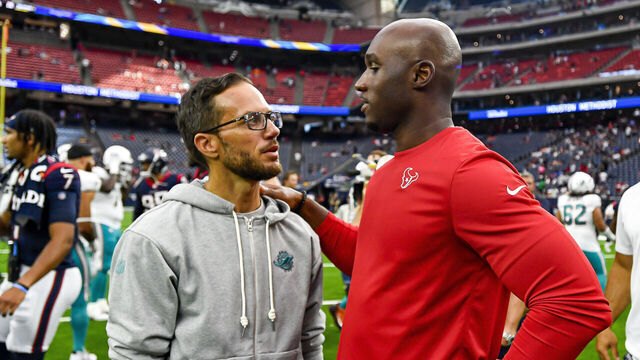 HOUSTON, TEXAS - AUGUST 19: Houston Texans head coach DeMeco Ryans (R) and Miami Dolphins head coach Mike McDaniel talk at midfield after the preseason game at NRG Stadium on August 19, 2023 in Houston, Texas.