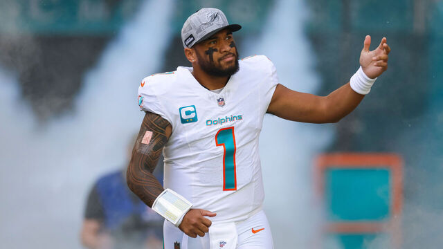 MIAMI GARDENS, FLORIDA - DECEMBER 17: Tua Tagovailoa #1 of the Miami Dolphins runs out of the tunnel during player introductions prior to a game against the New York Jets at Hard Rock Stadium on December 17, 2023 in Miami Gardens, Florida.