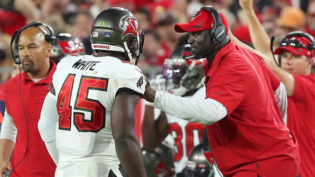 TAMPA, FL - JANUARY 9: Tampa Bay Buccaneers Defensive Coordinator Todd Bowles talks with Linebacker Devin White (45) during the regular season game between the Carolina Panthers and the Tampa Bay Buccaneers on January 9, 2022 at Raymond James Stadium in Tampa, Florida.