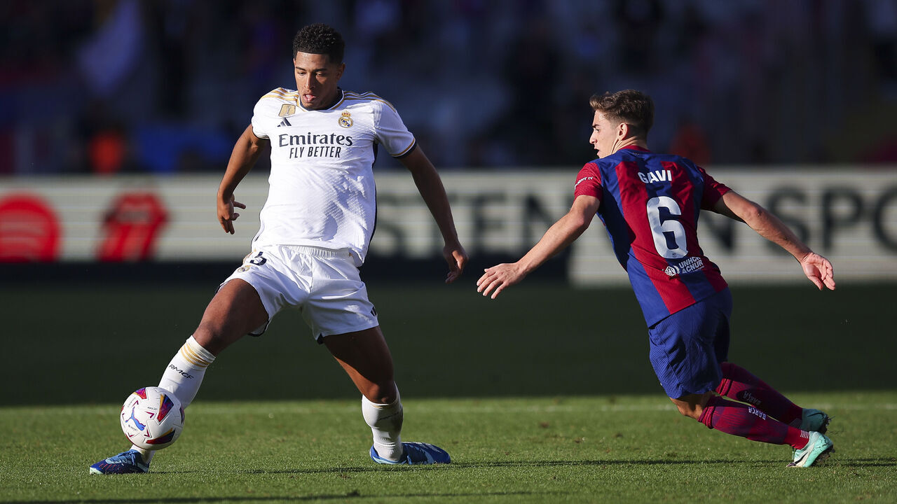 BARCELONA, SPAIN - OCTOBER 28: Jude Bellingham of Real Madrid challenges for the ball against Gavi of FC Barcelona during the LaLiga EA Sports match between FC Barcelona and Real Madrid CF at Estadi Olimpic Lluis Companys on October 28, 2023 in Barcelona, Spain.