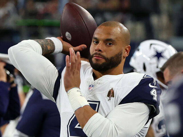 ARLINGTON, TEXAS - DECEMBER 10: Dak Prescott #4 of the Dallas Cowboys warms up on the sideline before the game against the Philadelphia Eagles at AT&T Stadium on December 10, 2023 in Arlington, Texas.