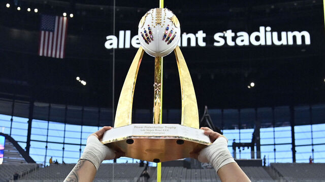 LAS VEGAS, NEVADA - DECEMBER 17: Heneli Bloomfield #58 of the Oregon State Beavers hoists up the championship trophy as he stands with teammates after the Beavers defeated the Florida Gators 30-3 in the SRS Distribution Las Vegas Bowl at Allegiant Stadium on December 17, 2022 in Las Vegas, Nevada.