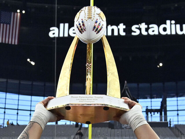 LAS VEGAS, NEVADA - DECEMBER 17: Heneli Bloomfield #58 of the Oregon State Beavers hoists up the championship trophy as he stands with teammates after the Beavers defeated the Florida Gators 30-3 in the SRS Distribution Las Vegas Bowl at Allegiant Stadium on December 17, 2022 in Las Vegas, Nevada.
