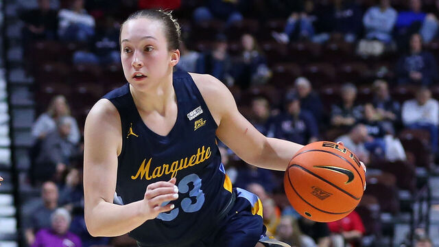 UNCASVILLE, CT - MARCH 04: Marquette Golden Eagles forward Liza Karlen (32) drives past St. John's Red Storm guard Jayla Everett (4) during the Big East Women's Basketball Tournament game between Marquette Golden Eagles and St John's Red Storm on March 4, 2023, at Mohegan Sun Arena in Uncasville, CT.