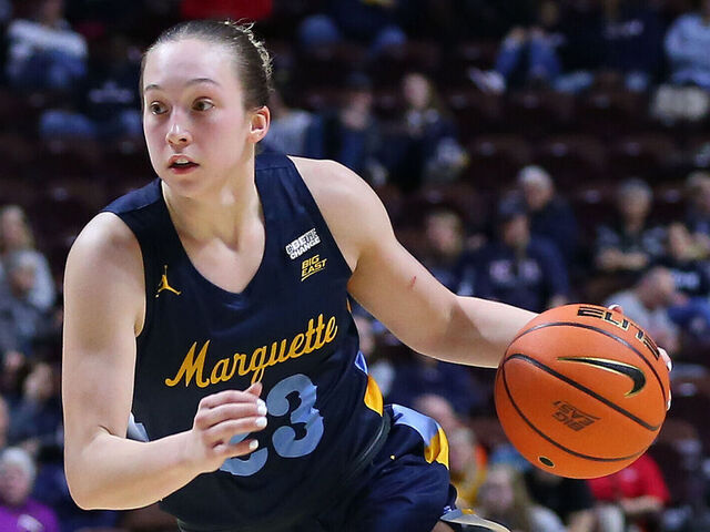 UNCASVILLE, CT - MARCH 04: Marquette Golden Eagles forward Liza Karlen (32) drives past St. John's Red Storm guard Jayla Everett (4) during the Big East Women's Basketball Tournament game between Marquette Golden Eagles and St John's Red Storm on March 4, 2023, at Mohegan Sun Arena in Uncasville, CT.