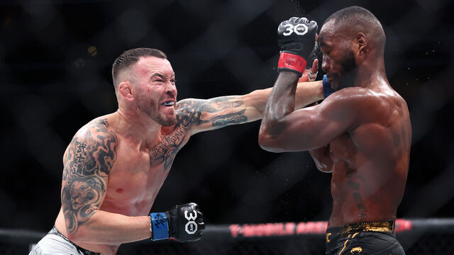 LAS VEGAS, NEVADA - DECEMBER 16: (L-R) Colby Covington of the United States throws a punch at Leon Edwards of Great Britain in a welterweight fight during the UFC Fight Night event at T-Mobile Arena on December 16, 2023 in Las Vegas, Nevada.