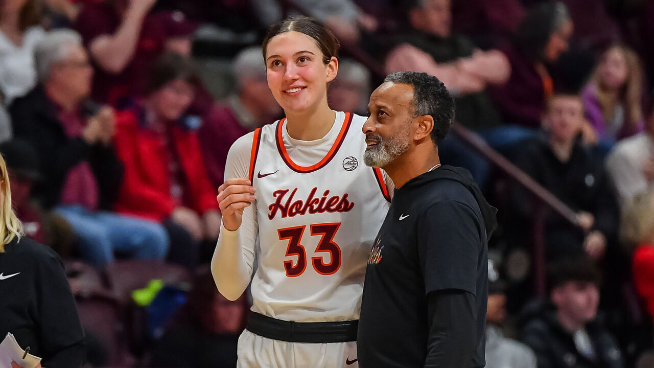 BLACKSBURG, VA - DECEMBER 10: Virginia Tech Hokies head coach Kenny Brooks and Virginia Tech Hokies center Elizabeth Kitley (33) during a time out during a college basketball game between the Radford Highlanders and the Virginia Tech Hokies on December 10, 2023 in Cassell Coliseum in Blacksburg, VA.